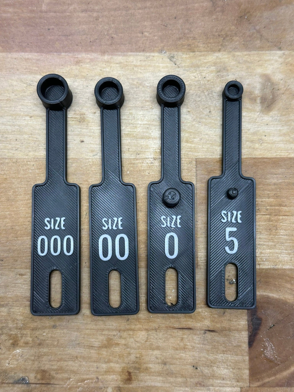 Capsule filler scoop set in multiple sizes for filling empty capsules